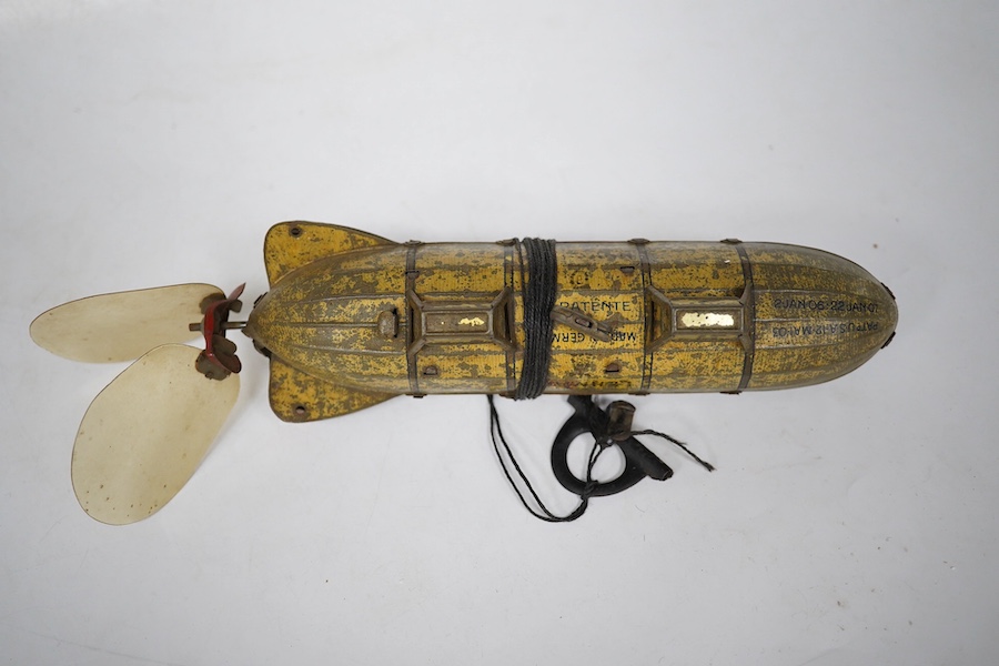 An early 20th century Lehmann tinplate clockwork EPL-1 zeppelin, 651, with rotating propellers to the rear. Condition - poor to fair, considerable losses to paint work, however clockwork motor still has some strength.